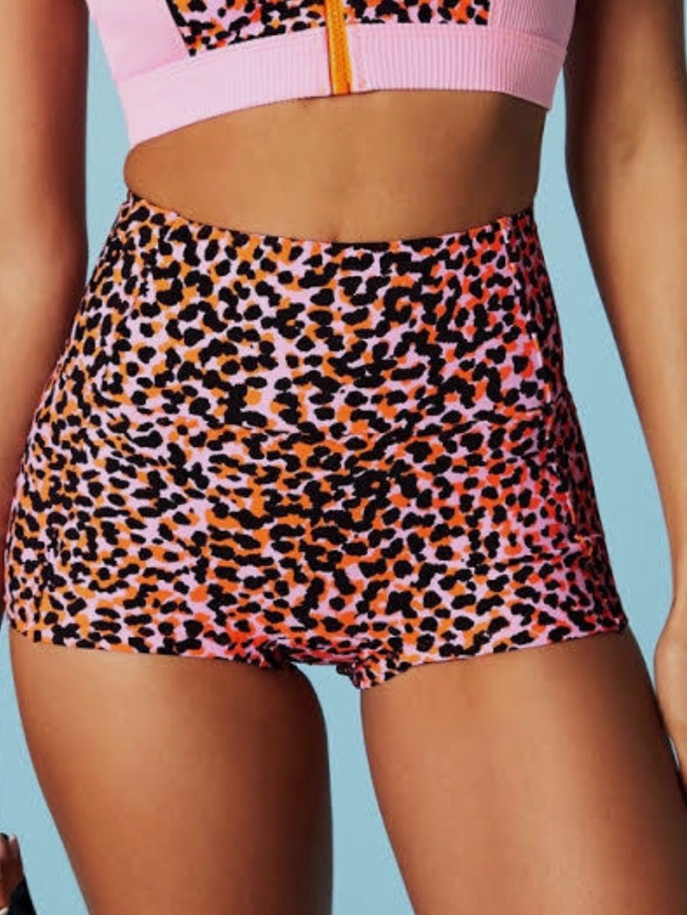 Fabletics high-waisted activewear shorts with the Flash Orange Safari Spots Sz L